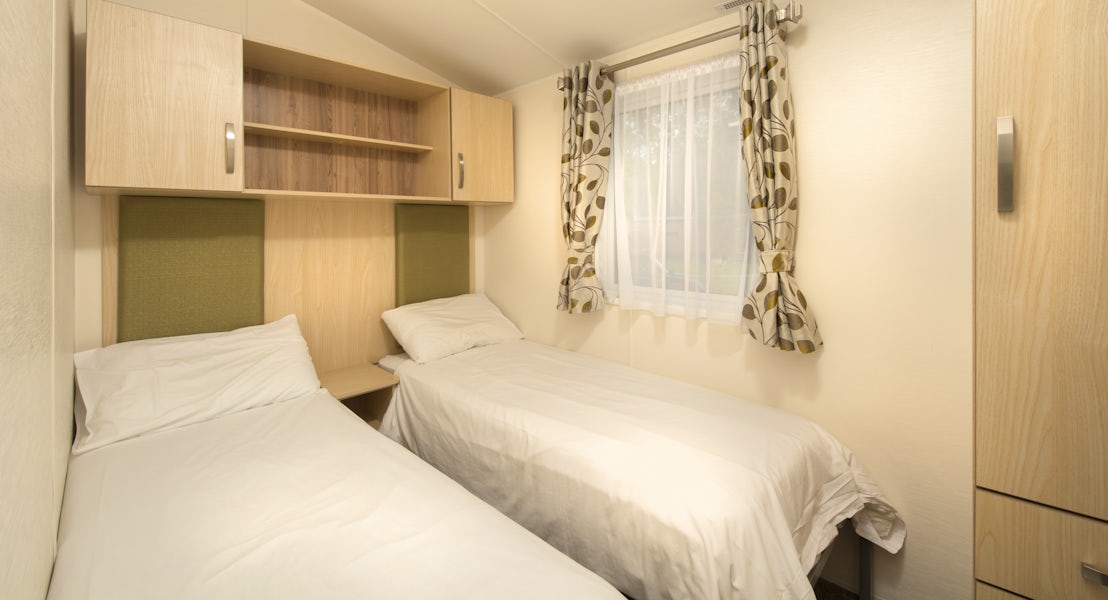 Gold Caravan Lodge Twin Bedroom