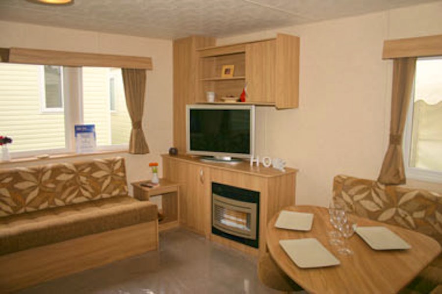 Living room ¦ Bronze caravan with outdoor decking area