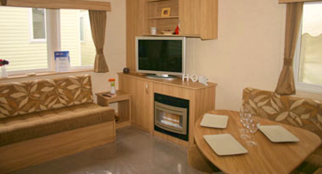 Living room ¦ Bronze caravan with outdoor decking area