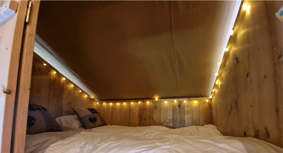 Inside cabin bed ¦ Safari Tent plus