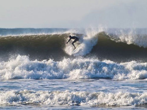 Surfer at Croyde Bay, Devon